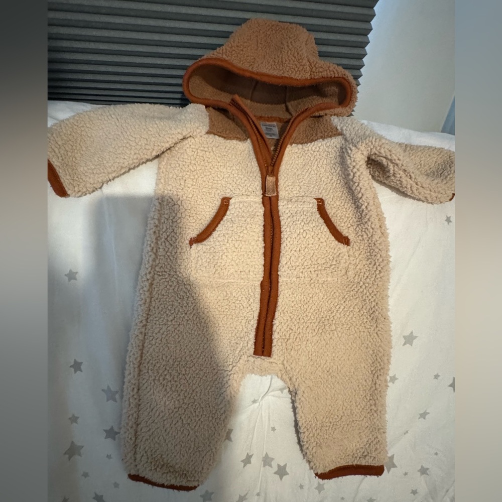 Fleece long sleeve onesie with hood.